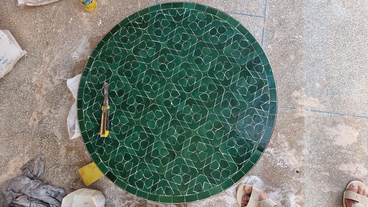 Tavole Calde 80cm Diam Handcrafted Moroccan Mosaic  Table Matrix Green  With Iron Base And 2 Maintenance Products. New But Unused Old Stock photo for sale