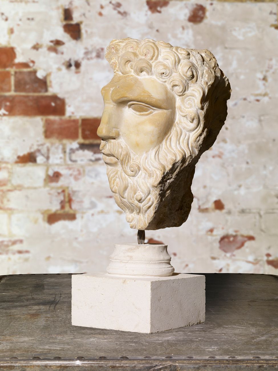 Carved Stone Head Of Hercules. photo for sale