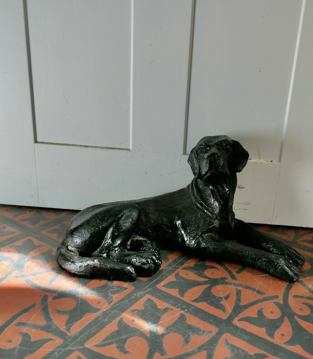 photo furniture A Black Labrador Puppy, Door Stop