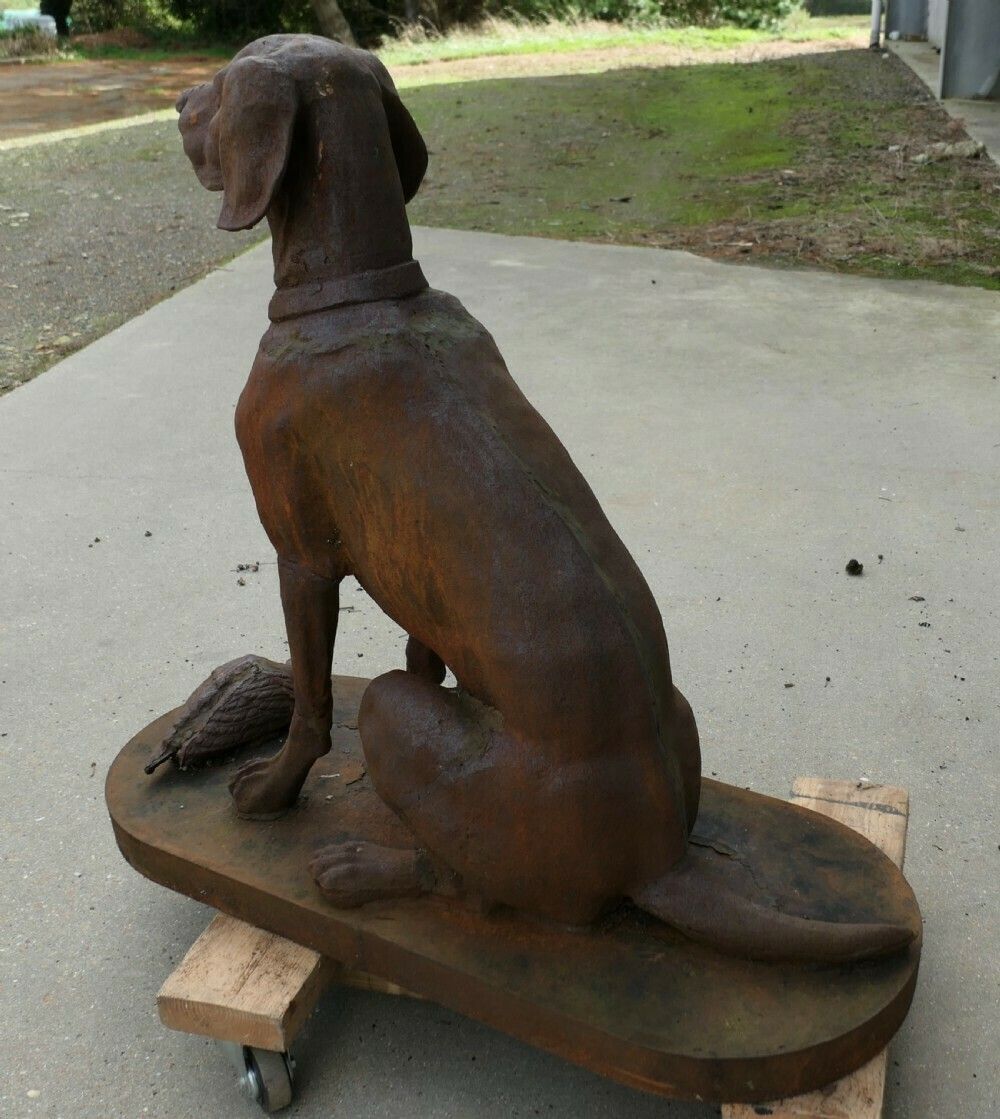 Cast Iron Statue Of A Hunting Dog Retrieving A Pheasant photo for sale