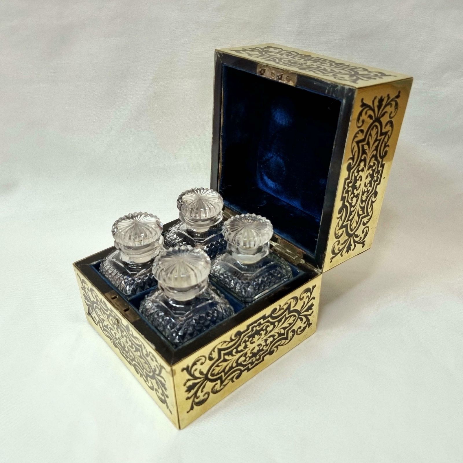 Antique Perfume Casket   An Exceptional 19th Century Ebony And Inlaid Brass Perfume Box With Four Original Bottles In Outstanding Condition. photo for sale