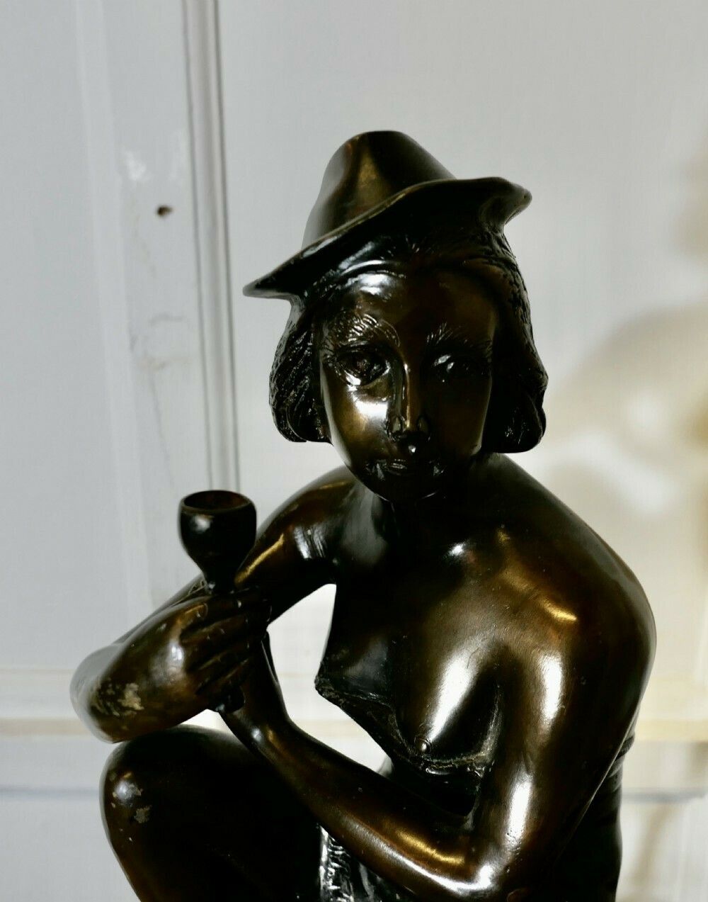 Bronze Statue Of A Girl On A Stool Drinking Champaign photo vinterior