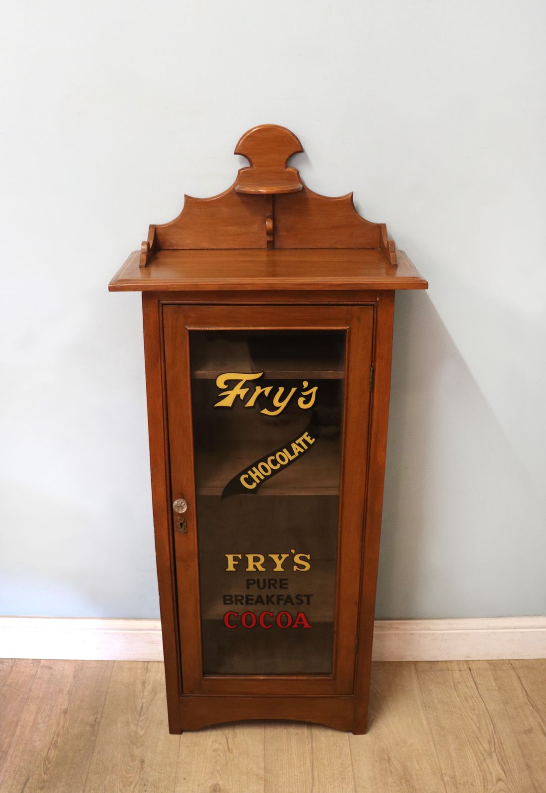 A Wonderful Victorian American Walnut Glazed Cabinet, Later Hand Sign Written Advertising For Fry's Chocolate. photo furniture