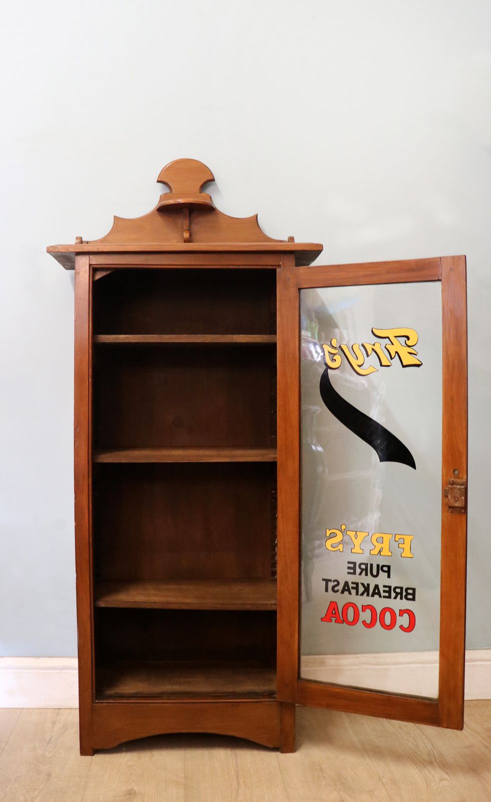 A Wonderful Victorian American Walnut Glazed Cabinet, Later Hand Sign Written Advertising For Fry's Chocolate. photo for sale