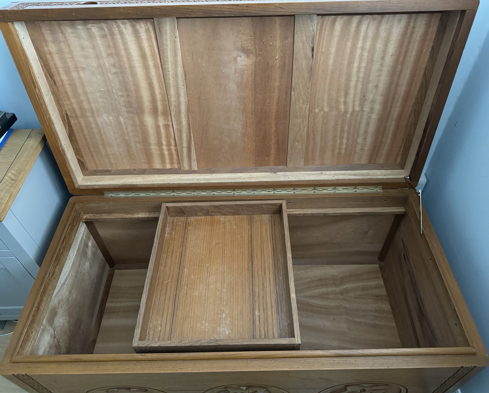 photo furniture Vintage Camphor Wood Chest With Engraved Symbols Of Blessing