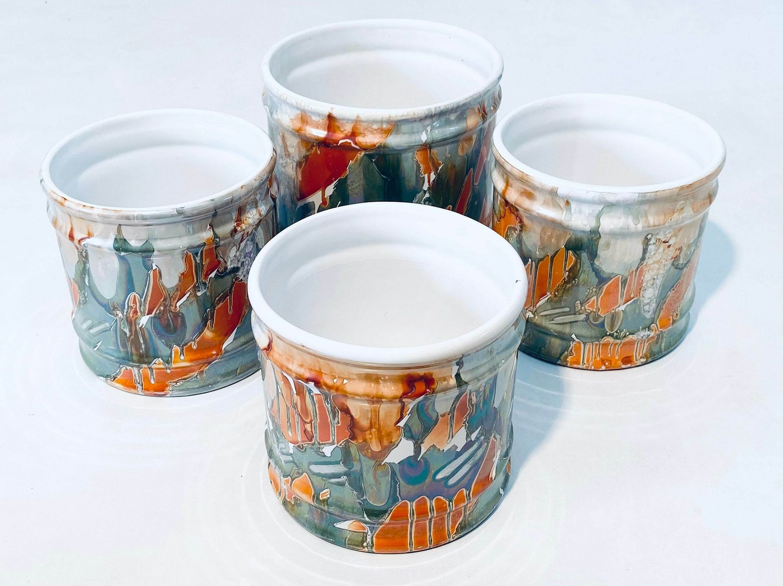 Four Matching Ceramic Planters Set With Dripping Glaze Motif / Orange Petrol White photo furniture