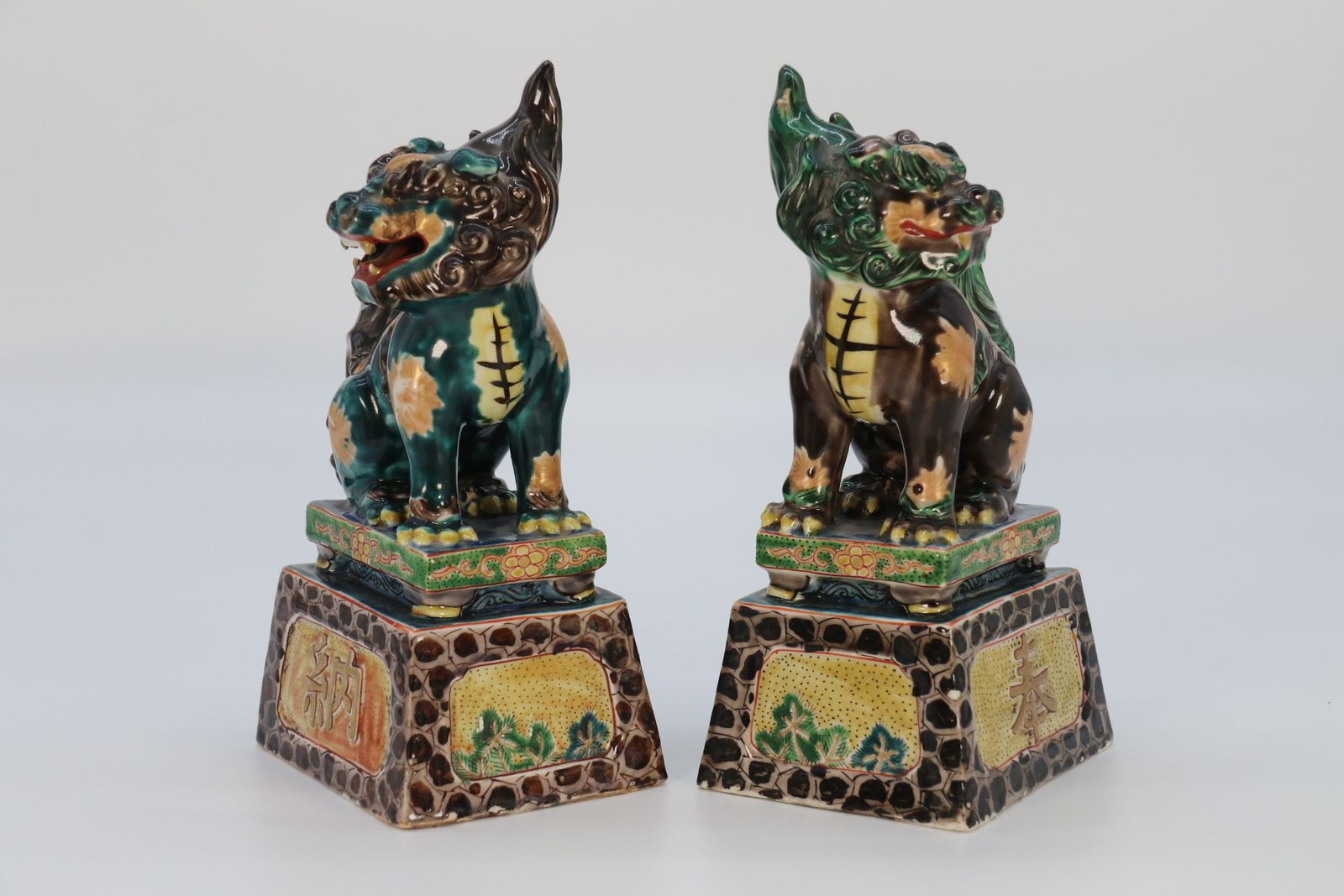 A Highly Decorative Pair Of Chinese Pottery Buddhist Lions Circa 1900. photo furniture