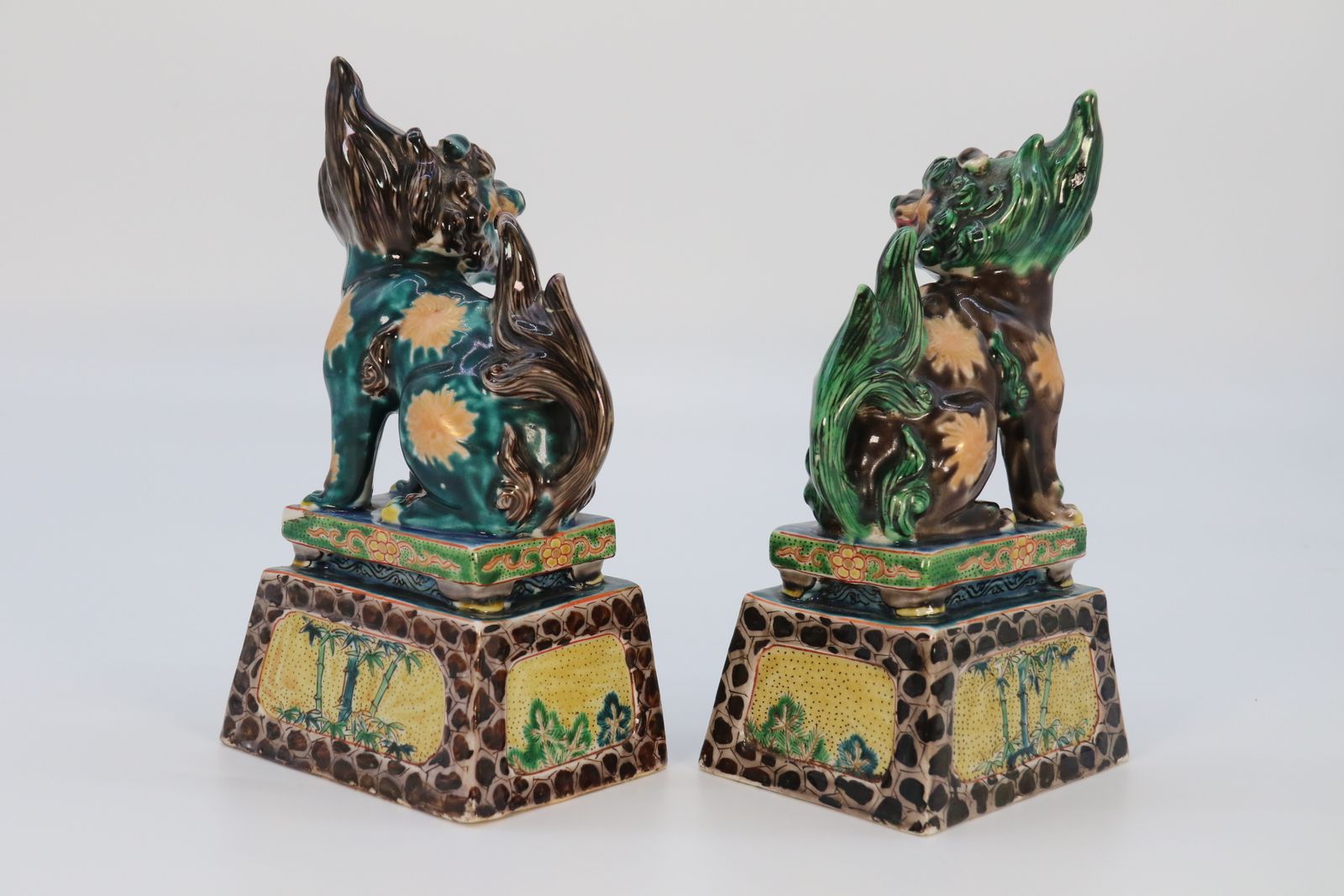 A Highly Decorative Pair Of Chinese Pottery Buddhist Lions Circa 1900. photo buy