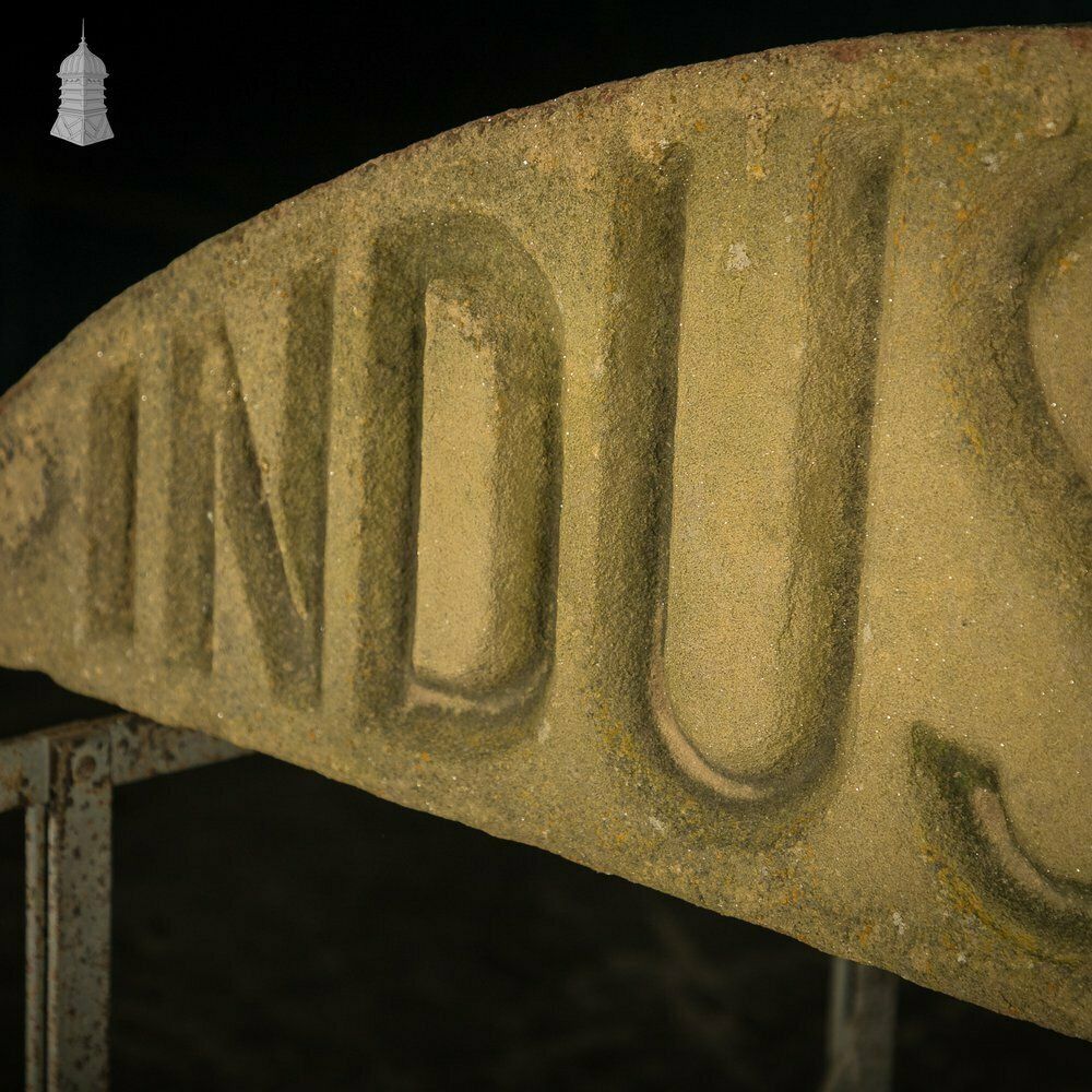 photo vinterior Industrial Door Head, Carved Stone Arched Overdoor Sign