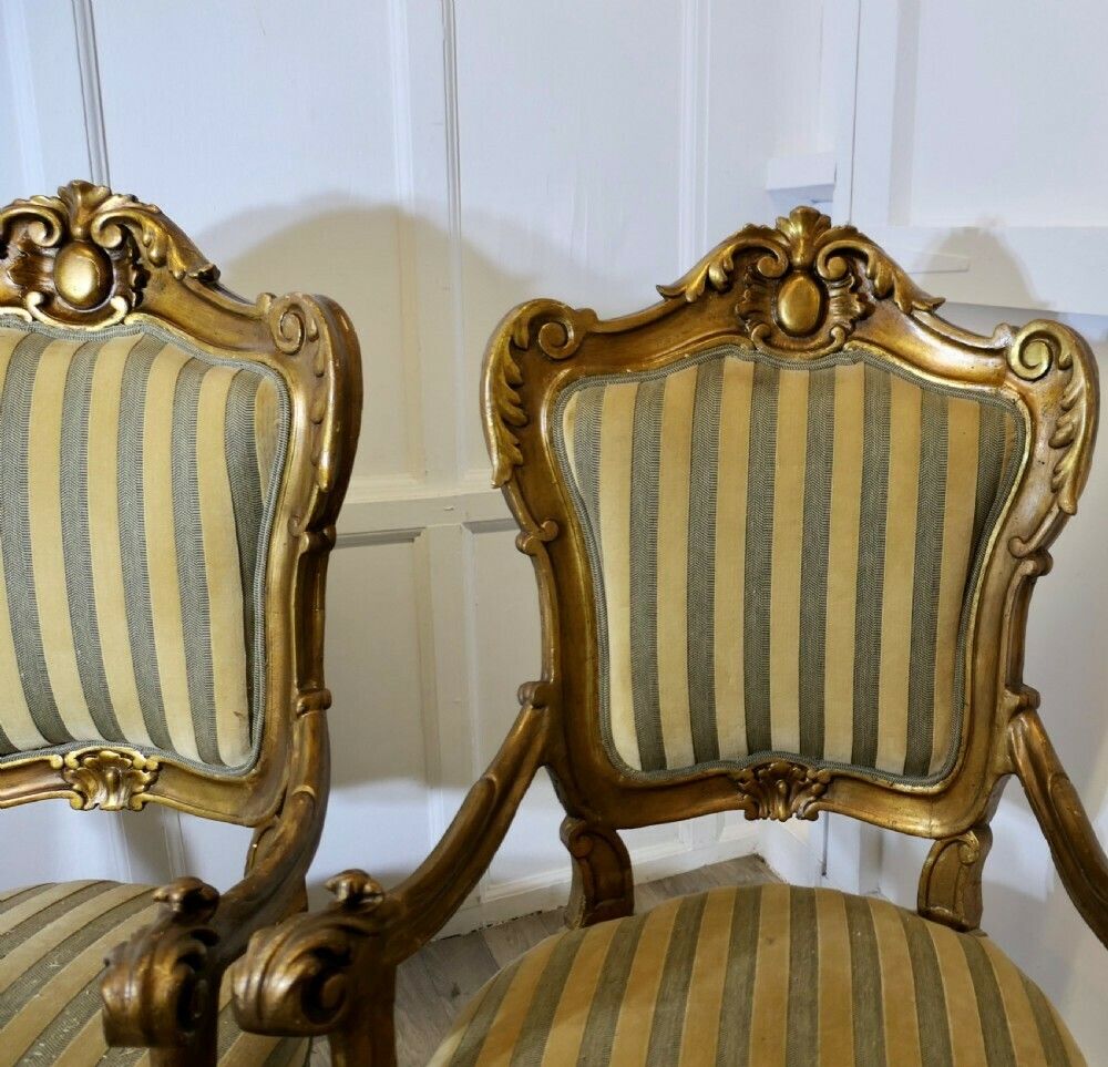 A Pair Of Large Italian Carved Giltwood Arm Chairs photo vinterior