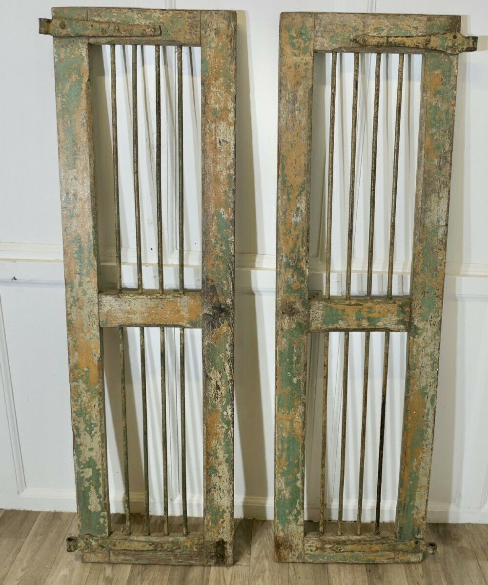 A Pair Of Antique Wood And Iron Window Shutters photo furniture