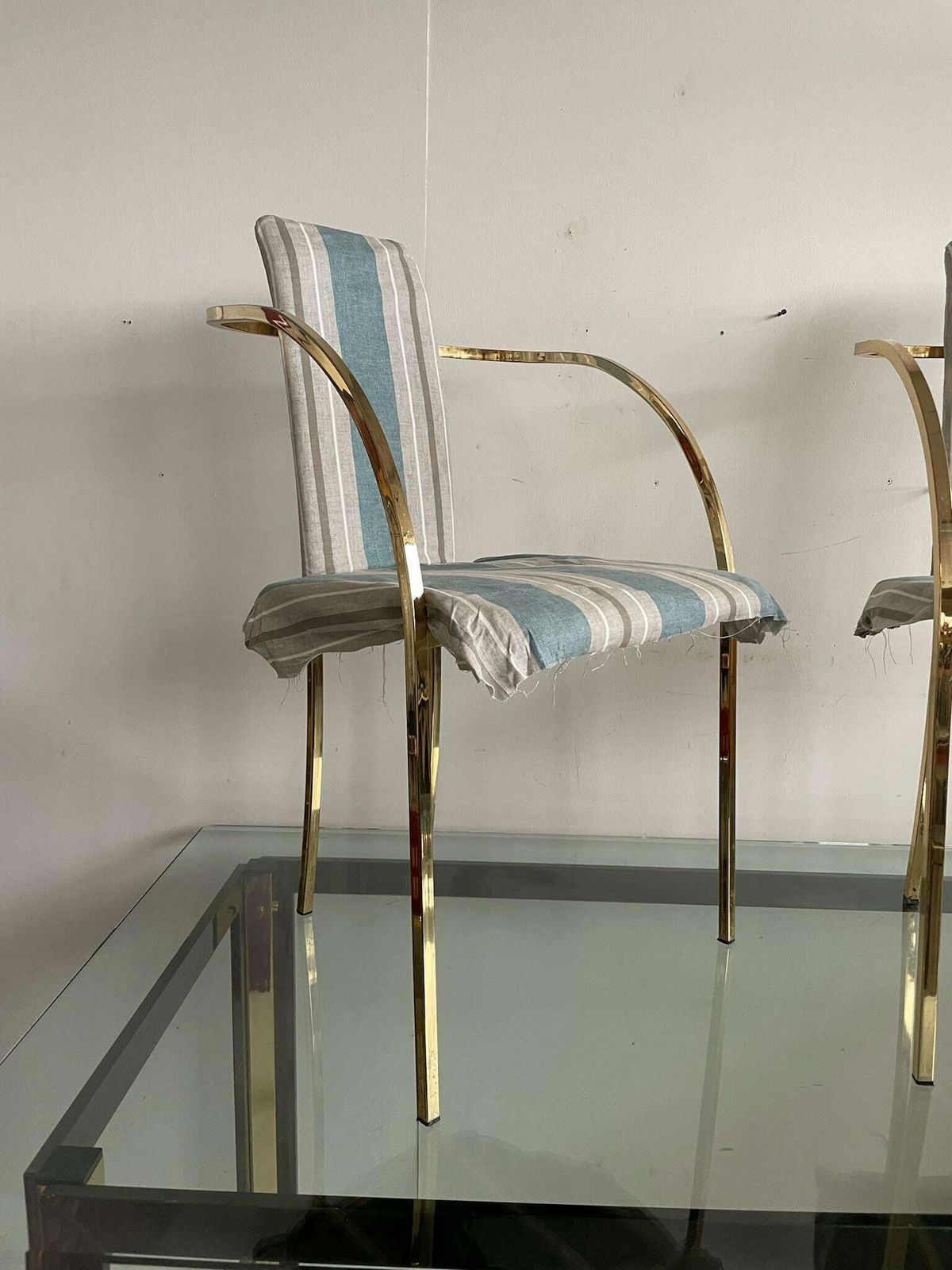 Sweeping Curved Arms That Meet At The Back And Form The Support And Legs. photo Furniture