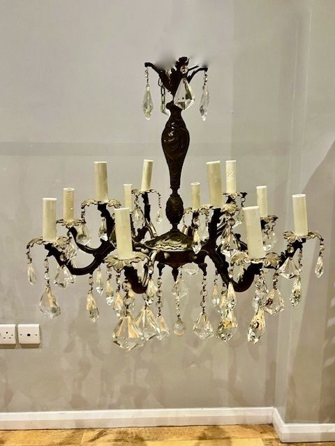 A Pair Of Dark Framed Twelve Light Of French Rococo Chandeliers photo furniture