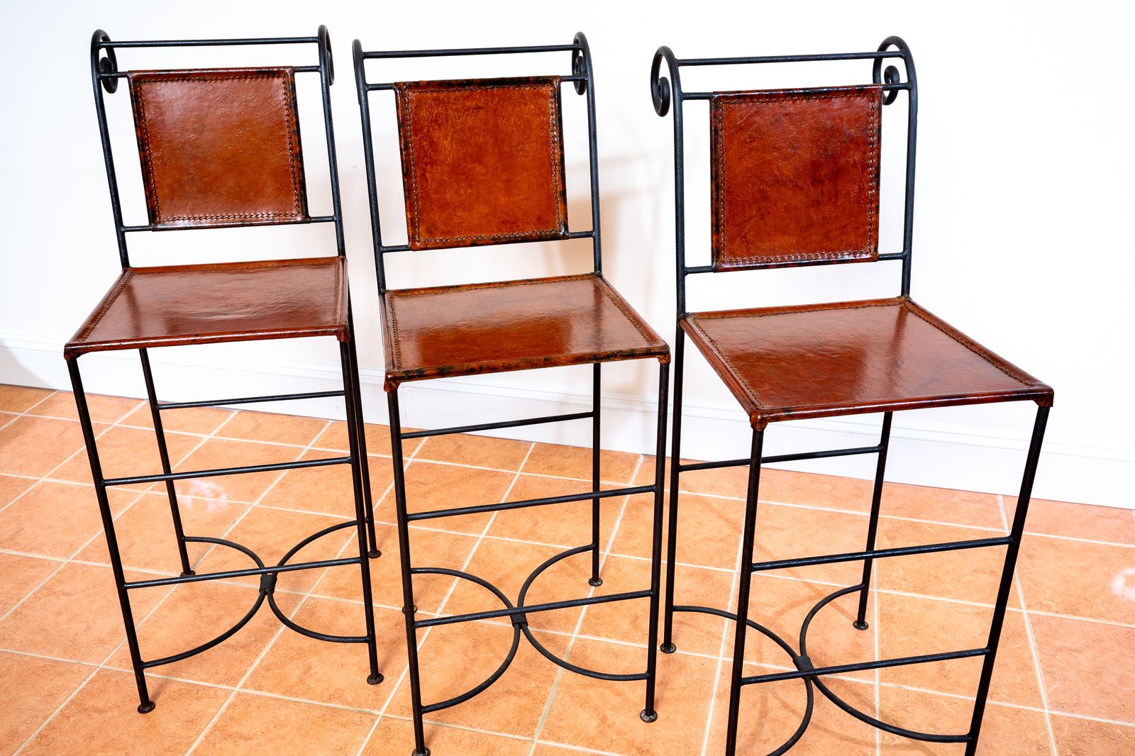 photo furniture 3 Ralph Lauren Barstools Tan Leather Wrought Iron High Bar Stools Neoclassical Designer Artisan Forged Hand Stitched Curule Art D.Eco