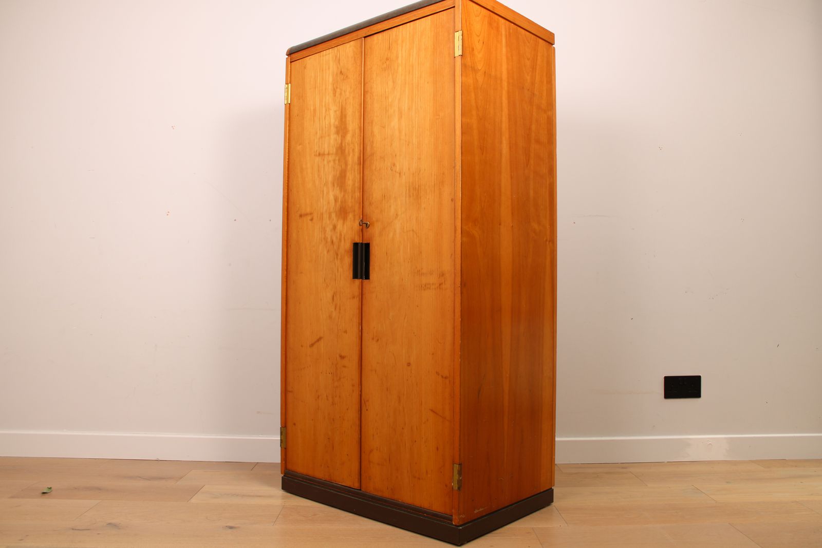 A Vintage Mid Century Cupboard, With Faux Leather Top And Recessed Metal Handles photo furniture