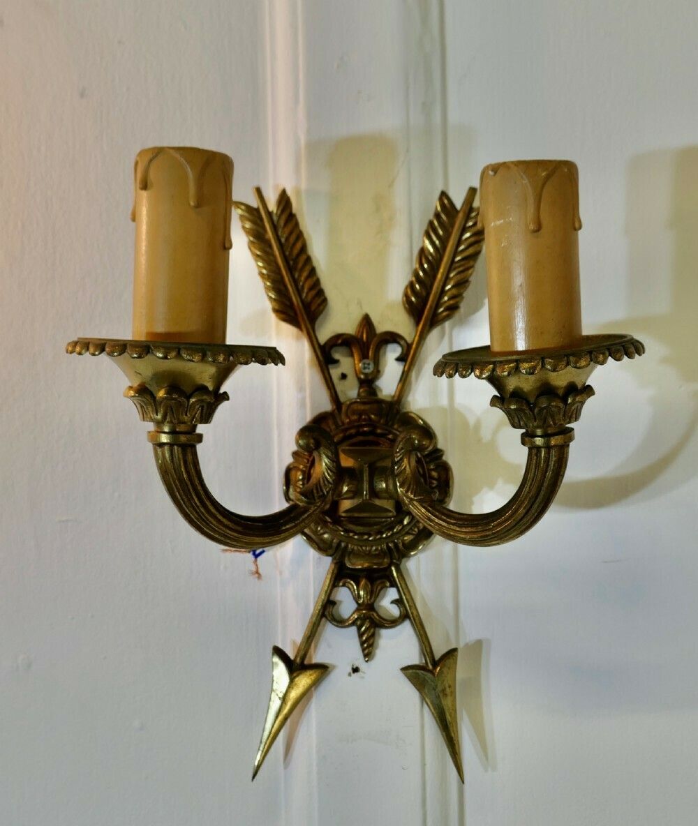 An Unusual Pair Of French Brass Twin Wall Lights, With Arrows photo furniture
