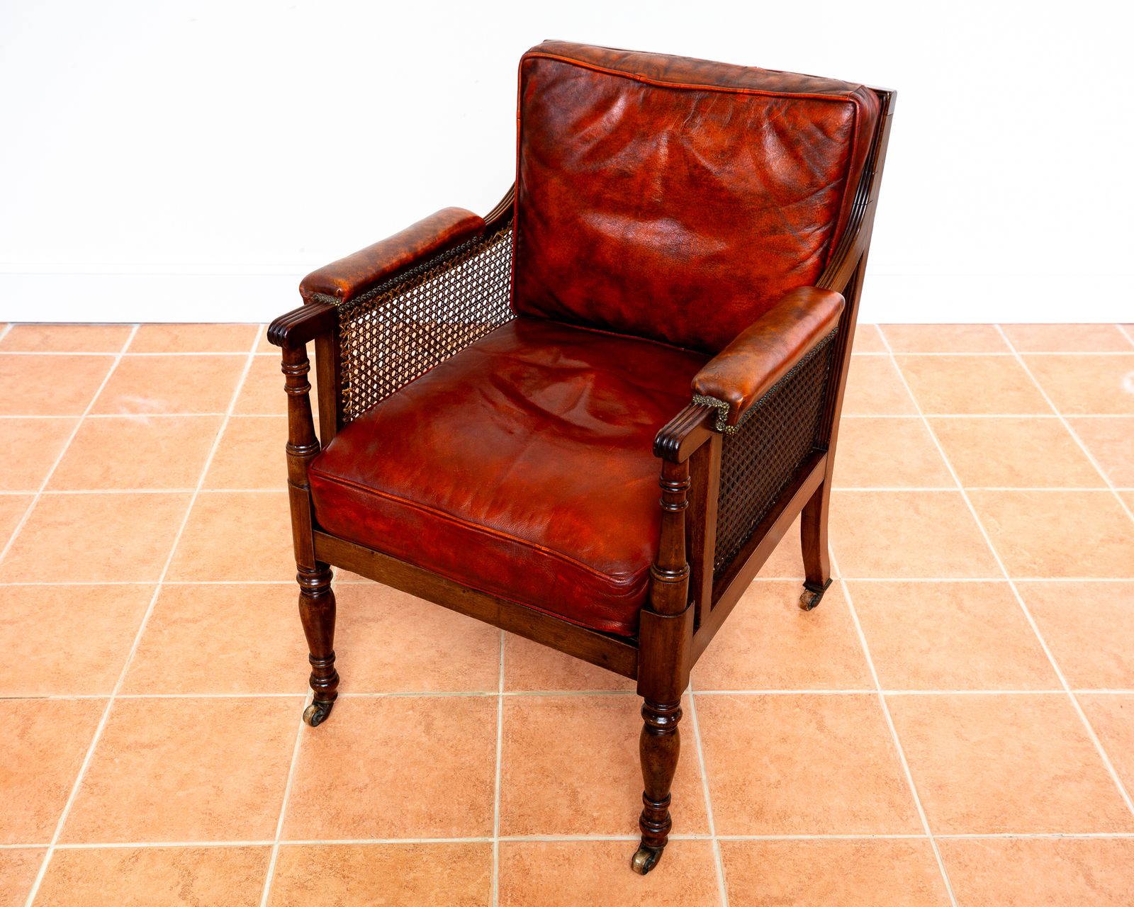 Fine Regency Bergere Leather Library Chair 1810 1820 Georgian Reading Red Leather Armchair Carved Cane Rattan Brass Castors photo 5750.0