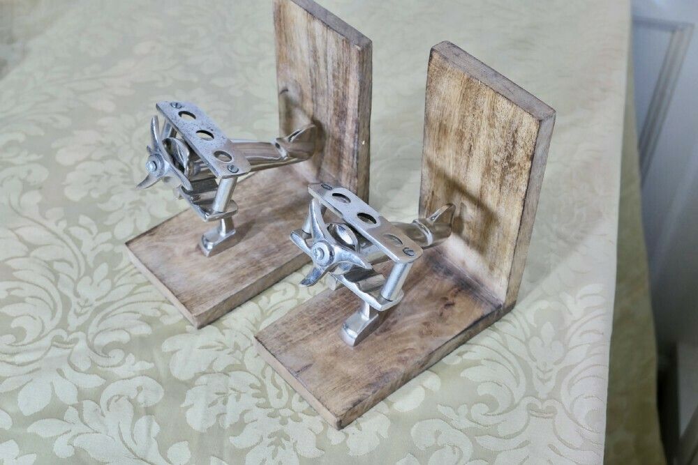 A Pair Of Mid Century Quirky Bookends On An Aeronautical Theme photo vinterior