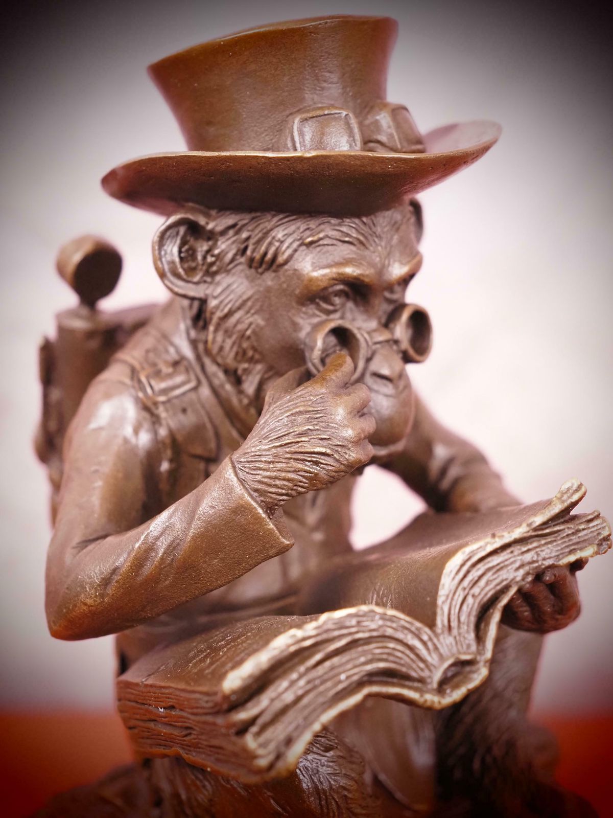 Bronze Steampunk Sculpture Of A Monkey On A Pile Of Books Philosophizing Monkey Statue Bronze photo for sale