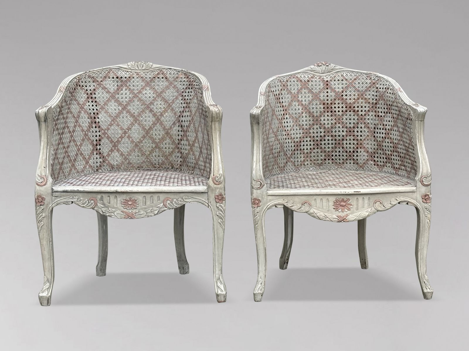 Pair Of French Louis XV Style Painted And Cane Bergère Armchairs
