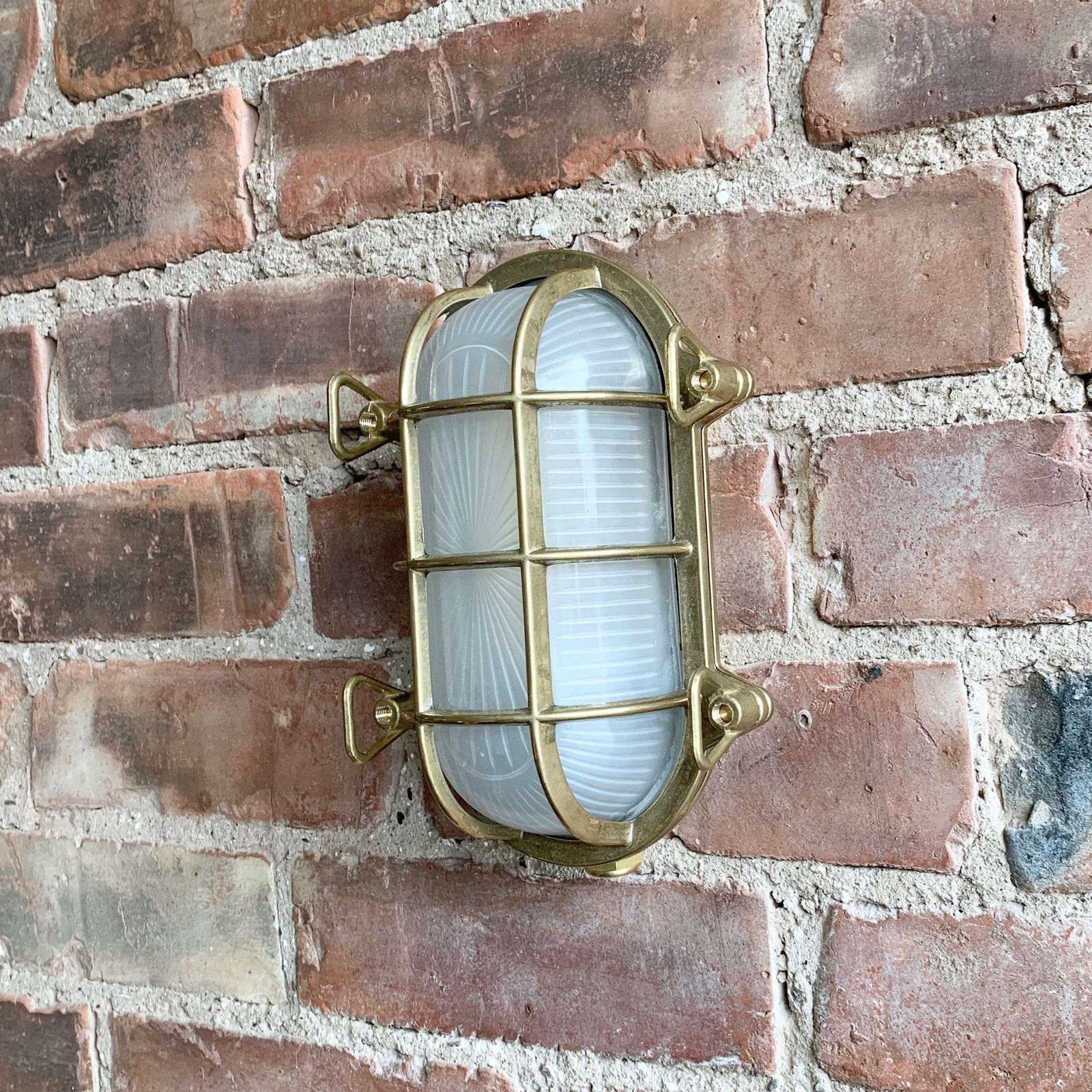 photo furniture Contemporary Polished Brass Oval Bulk Head Wall Light