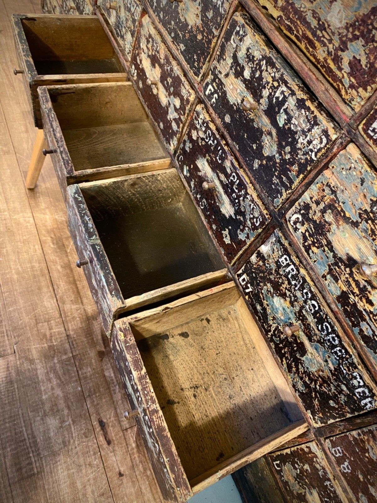 photo vinterior Antique English Large Bank Of 48 Ironmongers Shop Drawers. Industrial Storage.