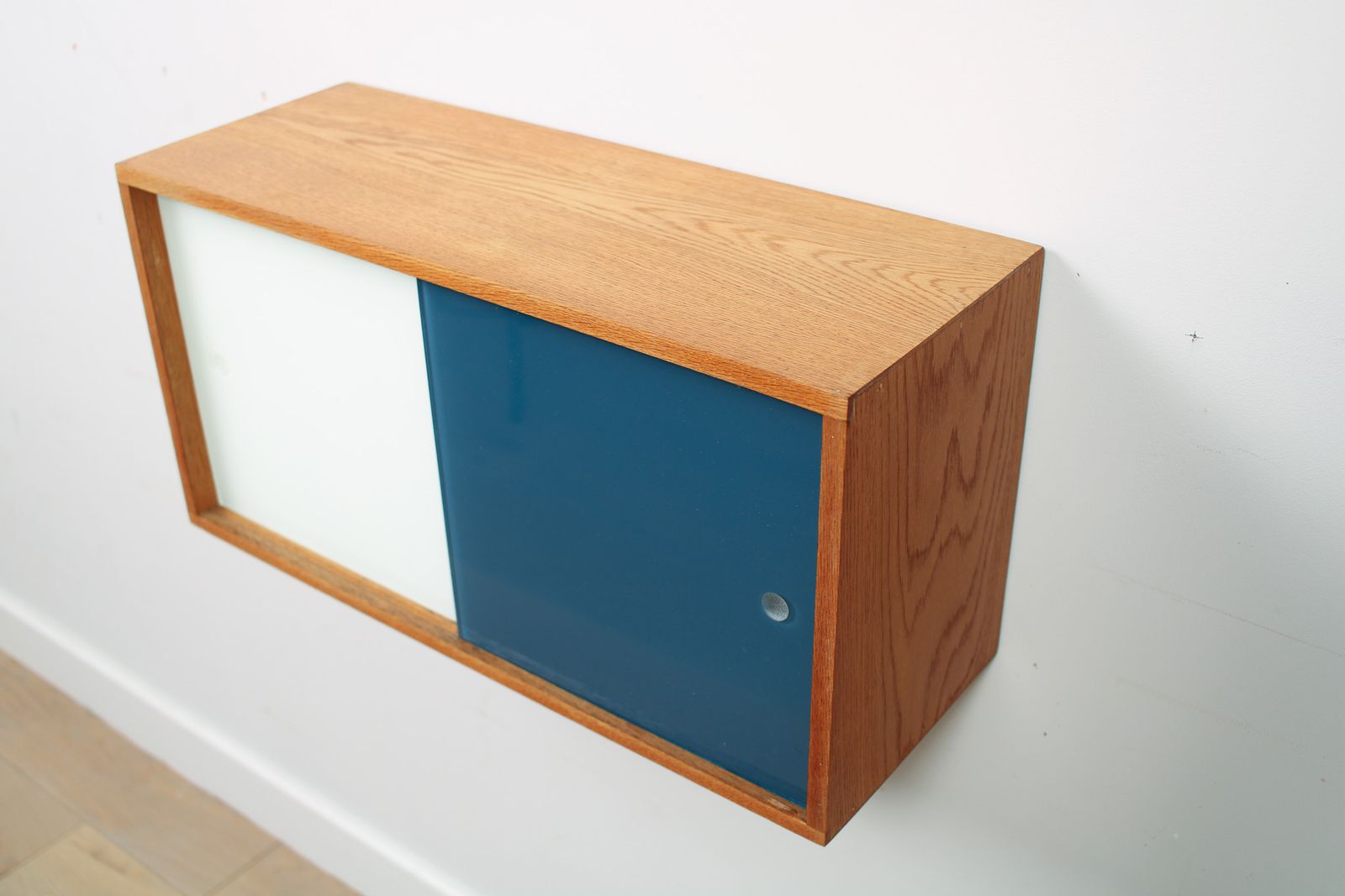 A Vintage Mid Century Wall Hung Oak Cabinet, Blue & White Sliding Glass Doors