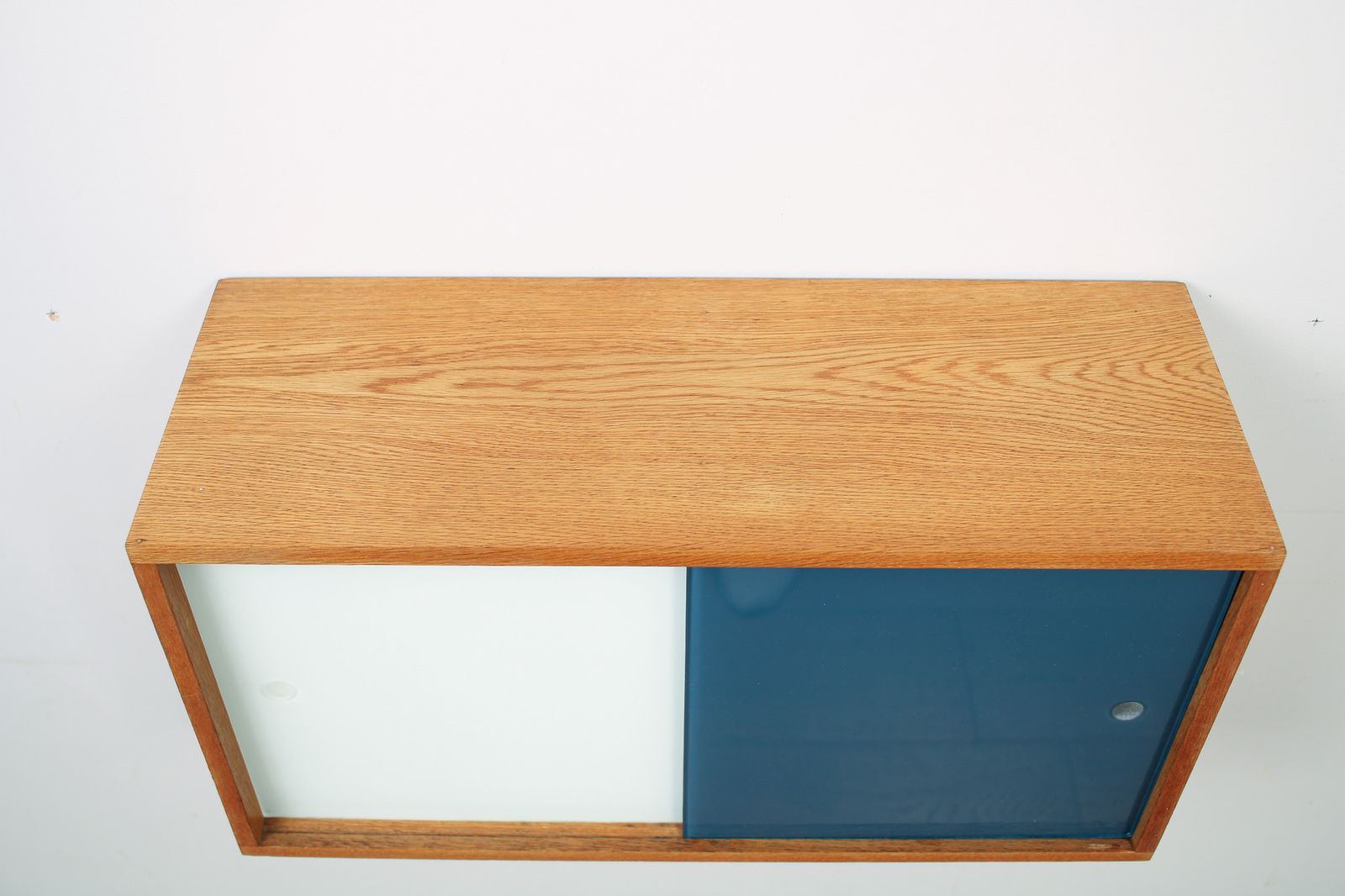 350.0 A Vintage Mid Century Wall Hung Oak Cabinet, Blue & White Sliding Glass Doors photo