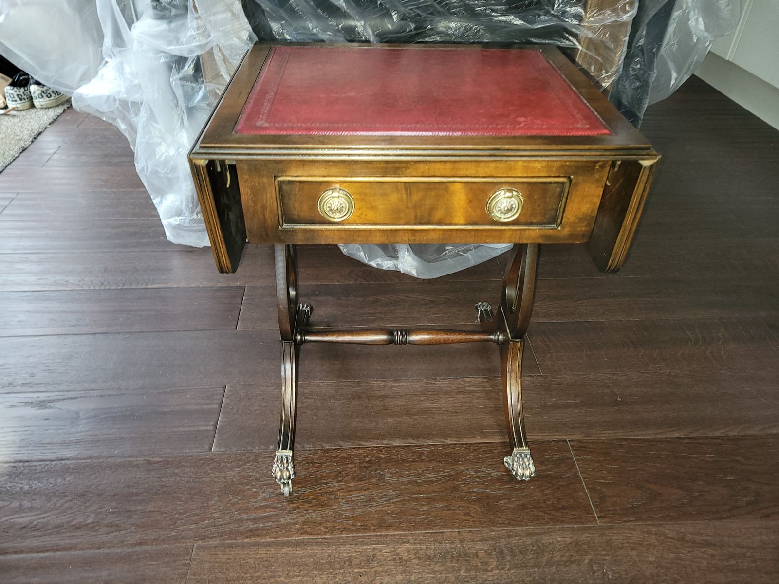 Drop Leaf Side Table. Oxblood Leather Top, Small Drawer, Brass Handles, Brass Claw Feet On Castors photo Furniture