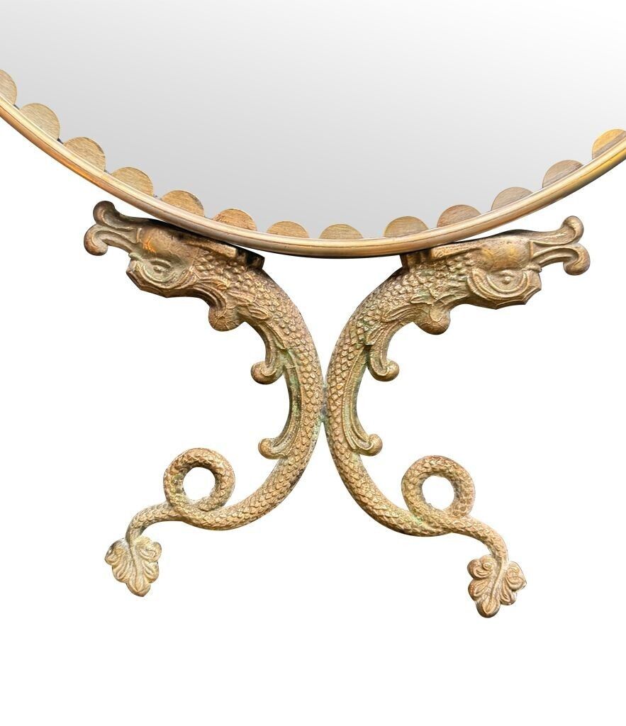 A Pair Of Italian 1940s Oval Mirrors With Dolphin Detailing Around The Brass Frame photo vintage