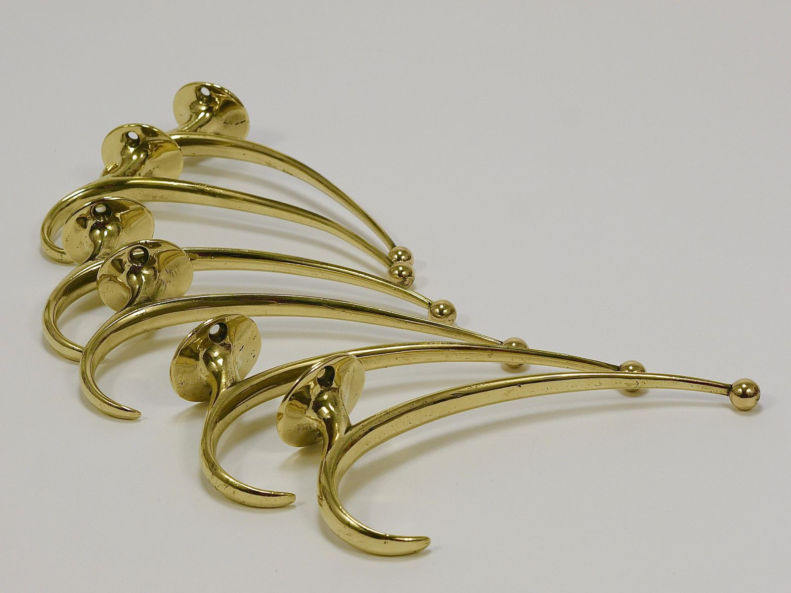 766.0 Two Franz Hagenauer Vienna Mid Century Curved Brass Wall Coat Hooks, 1950s photo
