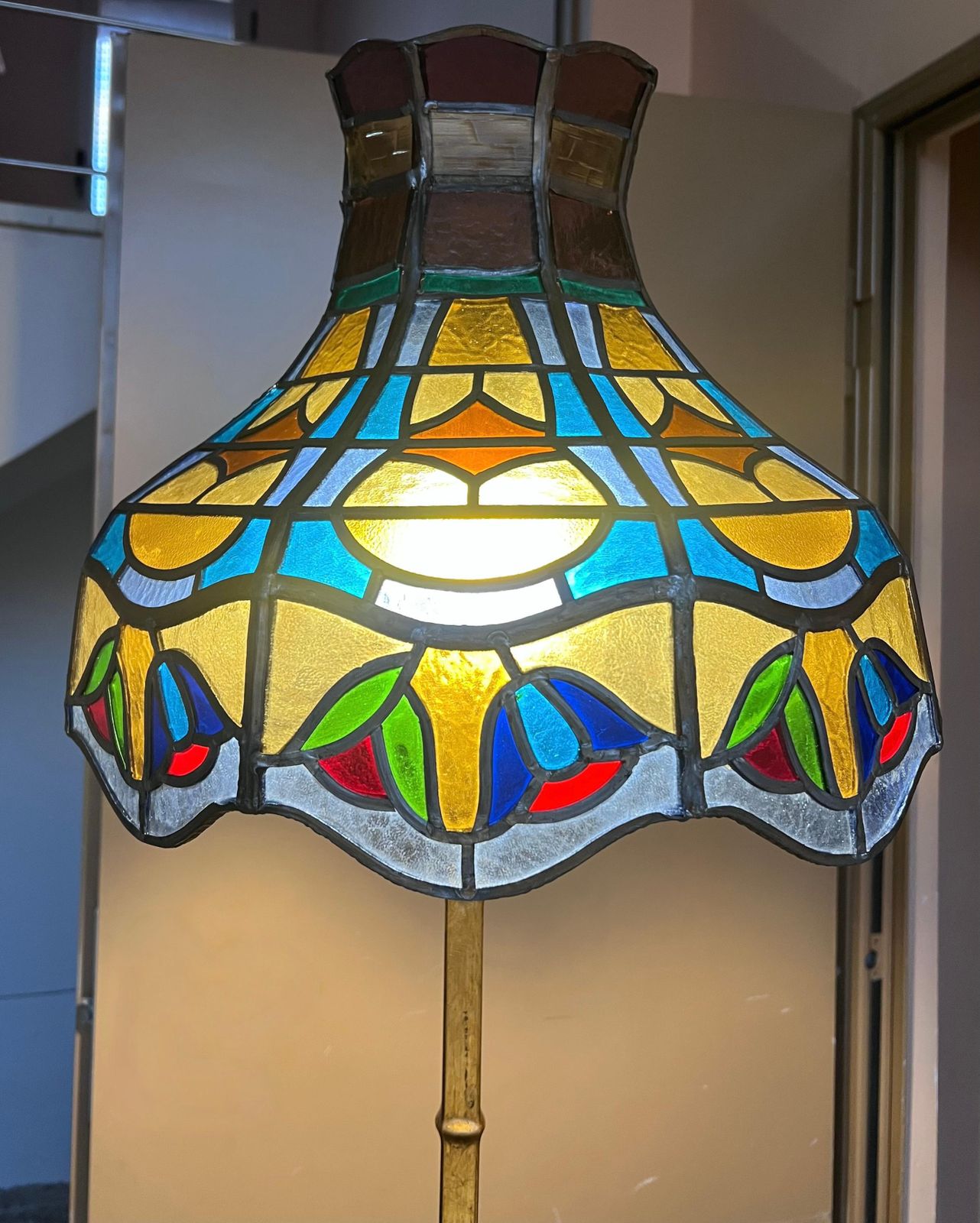 1553.0 1920’s Brass And Iron Floor Lamp With Vintage Tiffany Style Swirl Shade photo