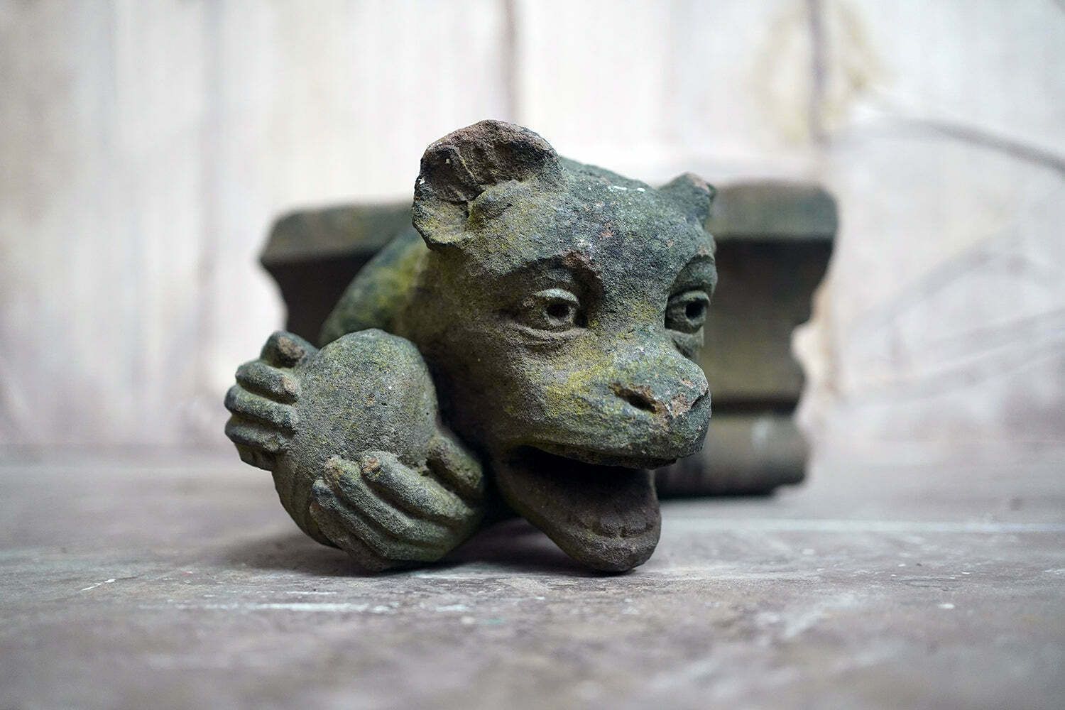A Rare Medieval Period Carved Stone Grotesque Holding A Coconut C.1300 1400