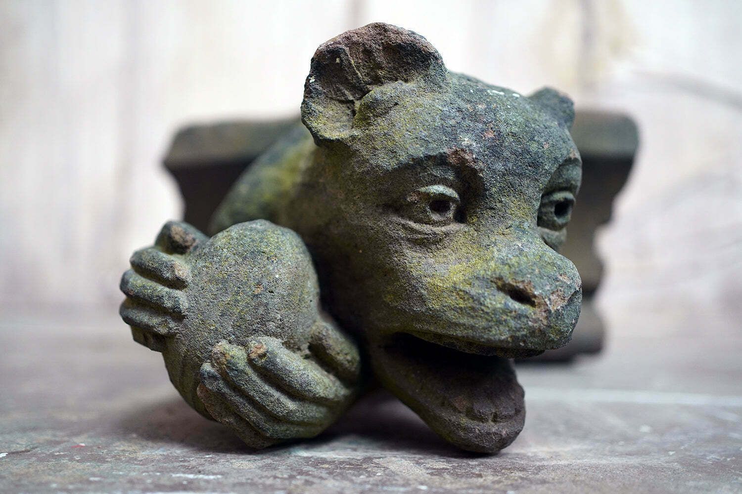 A Rare Medieval Period Carved Stone Grotesque Holding A Coconut C.1300 1400 photo furniture