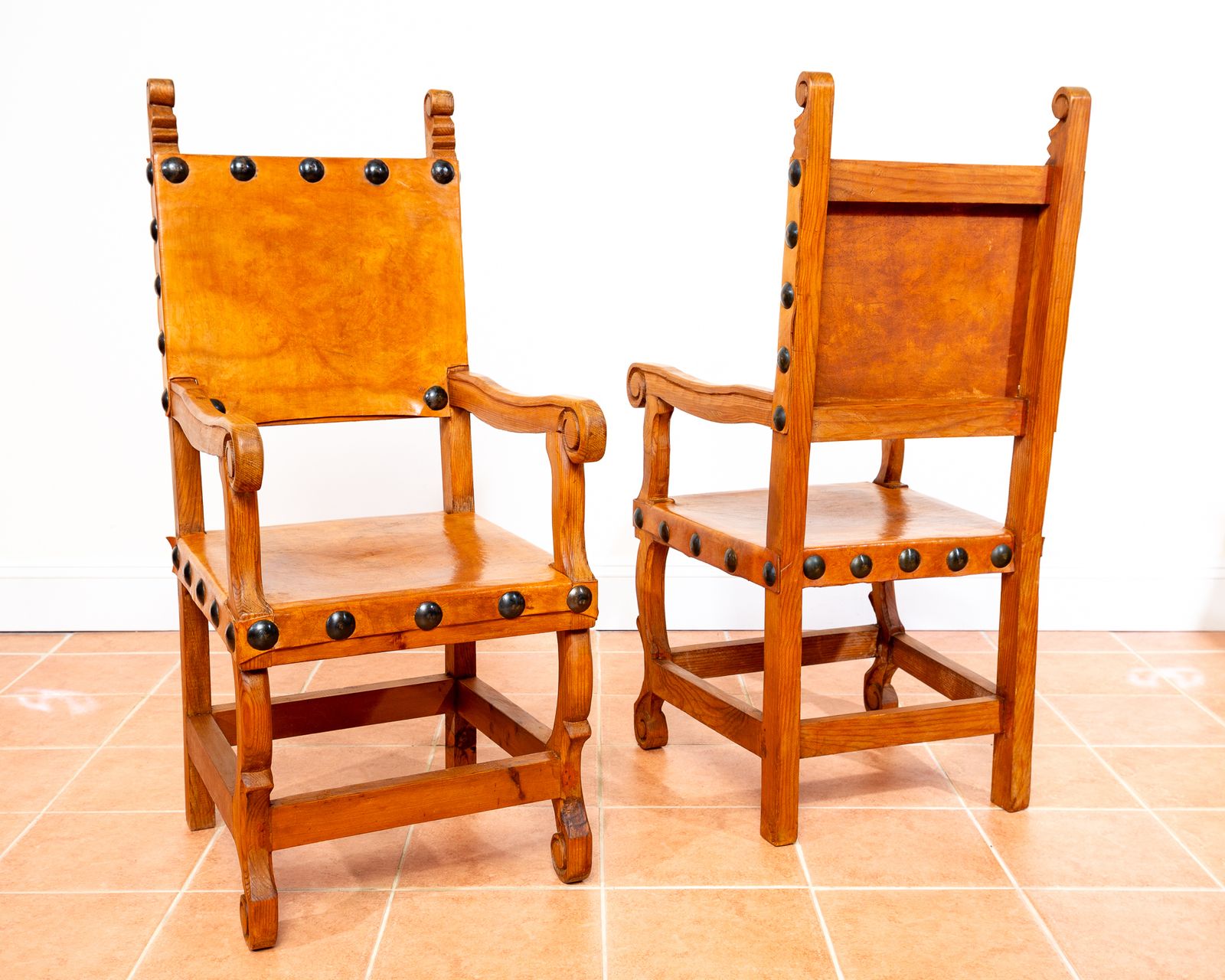 Pair Of Large Tan Leather Throne Chairs Spanish Colonial Baroque Style Mexican Studded Vintage Pine Hall Marriage Wedding Carver Dining Armchairs photo vinterior