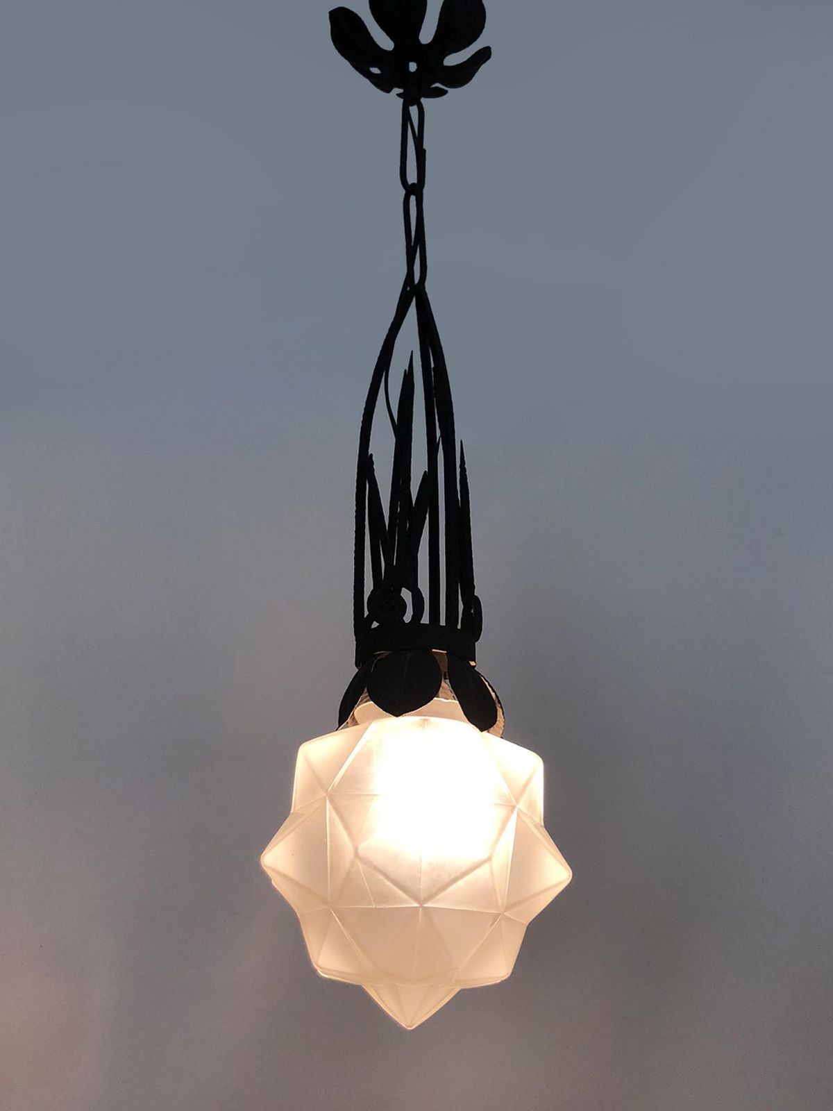 Chandelier, Art Deco Pendant Light In Wrought Iron And Star Globe In Glass Paste. 1930s photo furniture