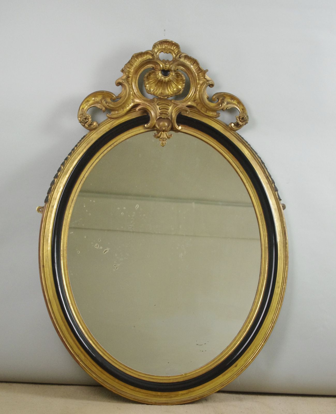 19th Century French Ebonised And Parcel Gilt Large Oval Wall Mirror