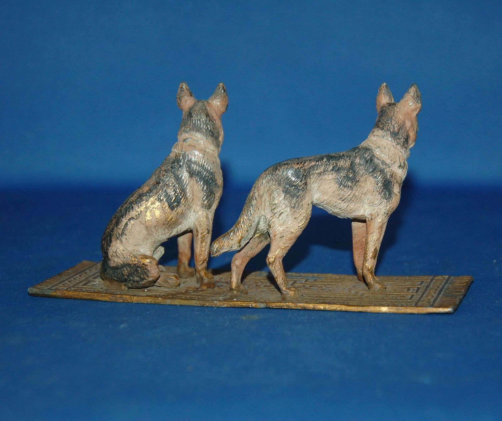 An Antique Cold Painted Cast Metal Alsatian Dog Pair On Carpet photo for sale