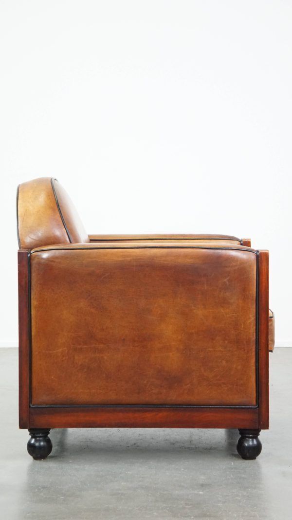 Timeless, Sleekly Finished Sheepskin And Wooden Art Deco Design Armchair With Ball Legs photo for sale
