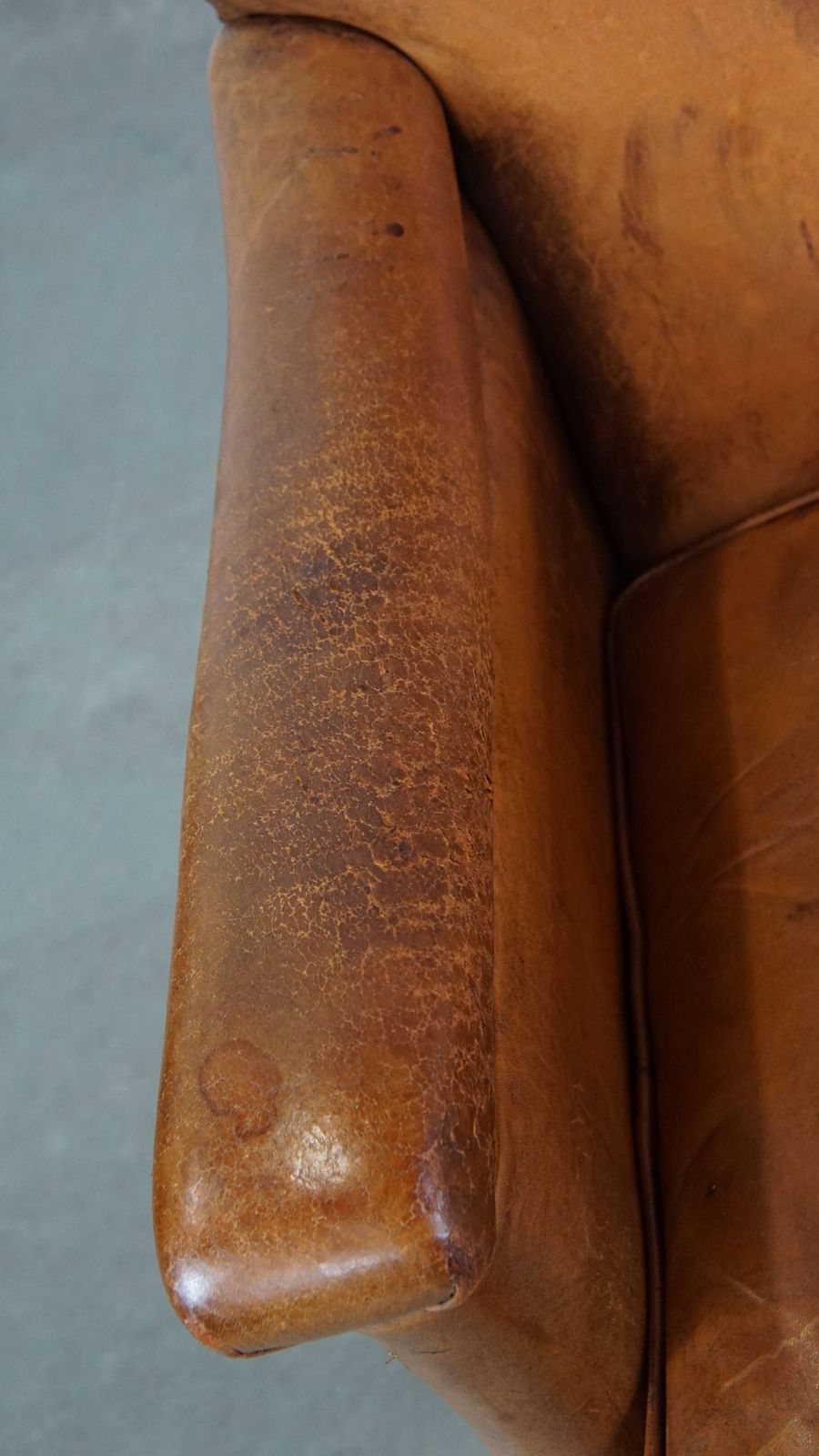 Characteristic And Comfortable Cognac Colored Sheepskin Armchair With Straight Shapes And A Beautiful Patina photo buy