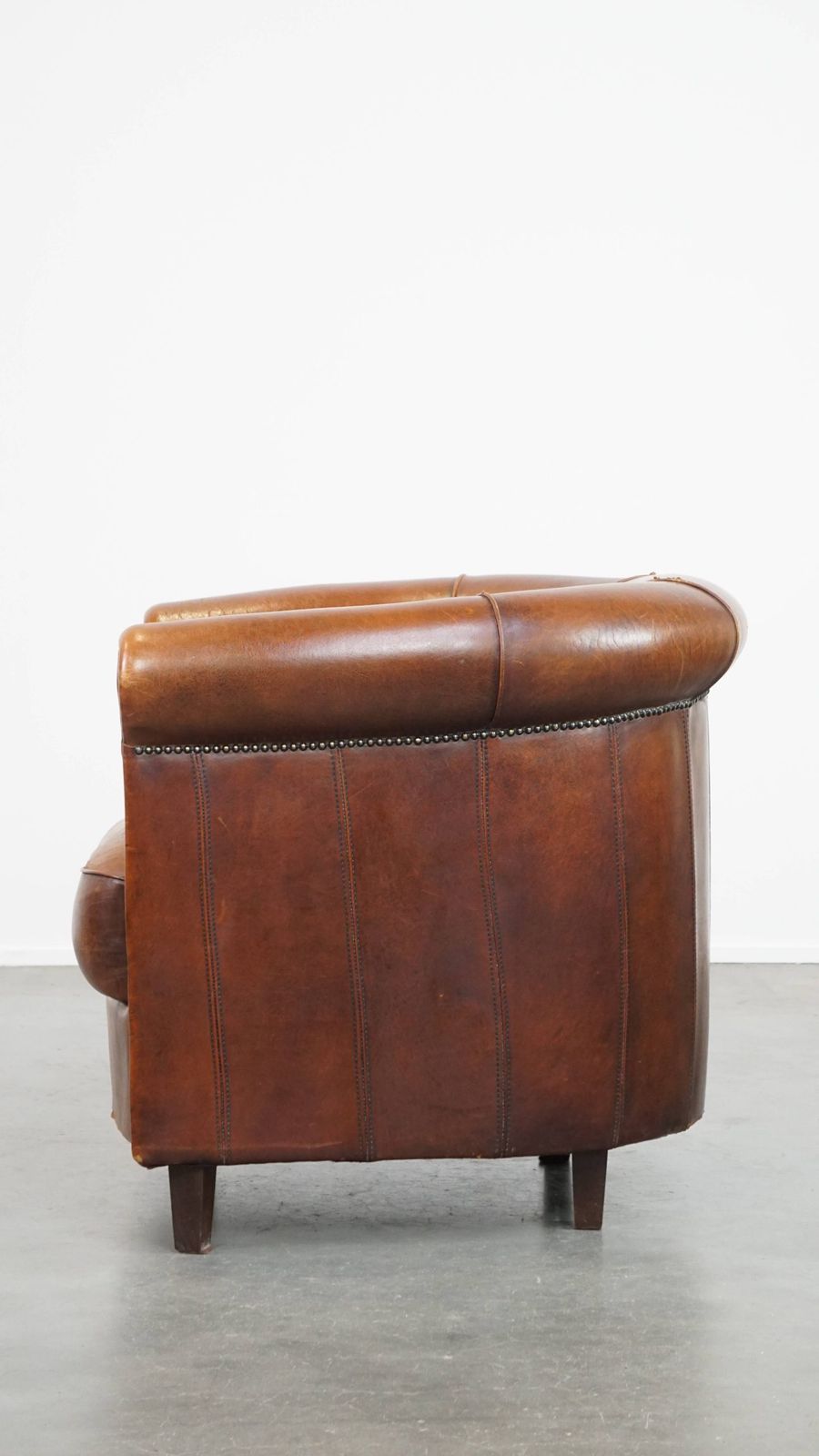Sheepskin Club Chair In A Charming Cognac Colour And Finished With Piping On The Backrest photo 1200.2964