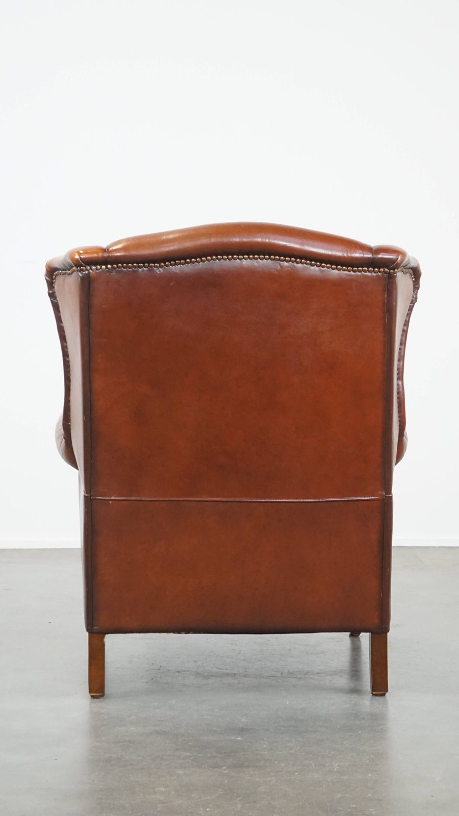 Comfortable Sheepskin Wing Chair With A Warm Color Scheme And A Beautiful Patina photo Furniture