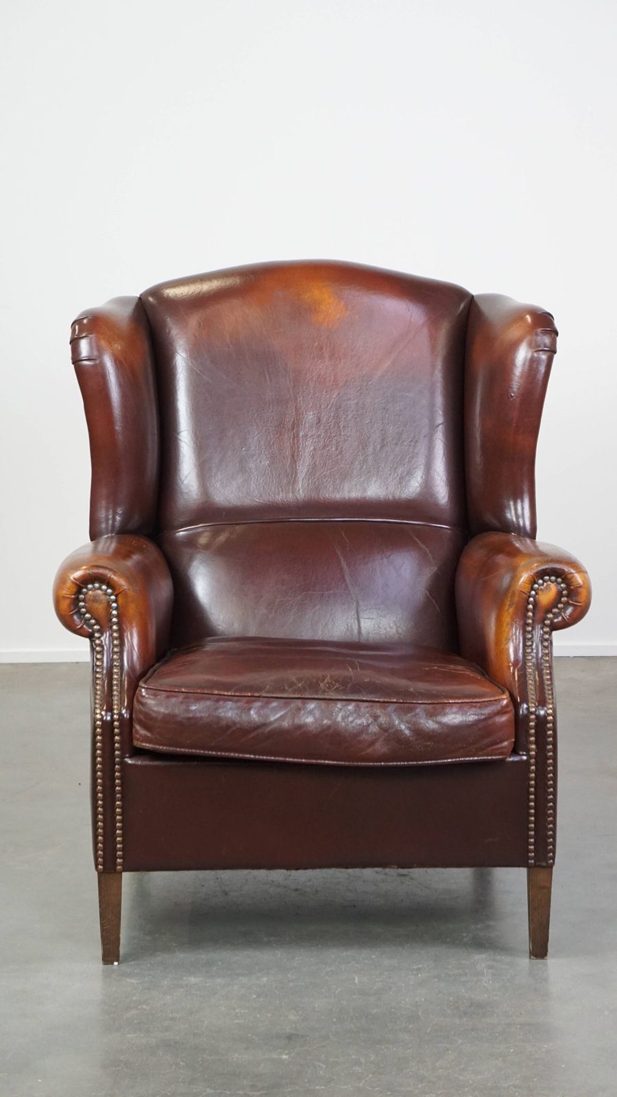 Classic, Luxurious And Comfortable Dark English Style Sheepskin Wing Chair With Lots Of Character And A Beautiful Patina photo furniture