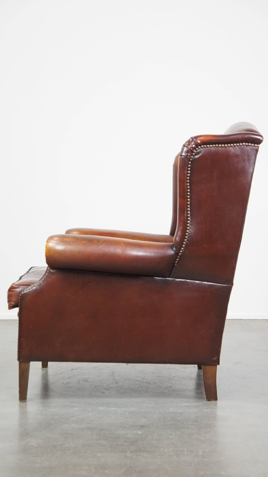 Classic, Luxurious And Comfortable Dark English Style Sheepskin Wing Chair With Lots Of Character And A Beautiful Patina photo 799.4753999999999