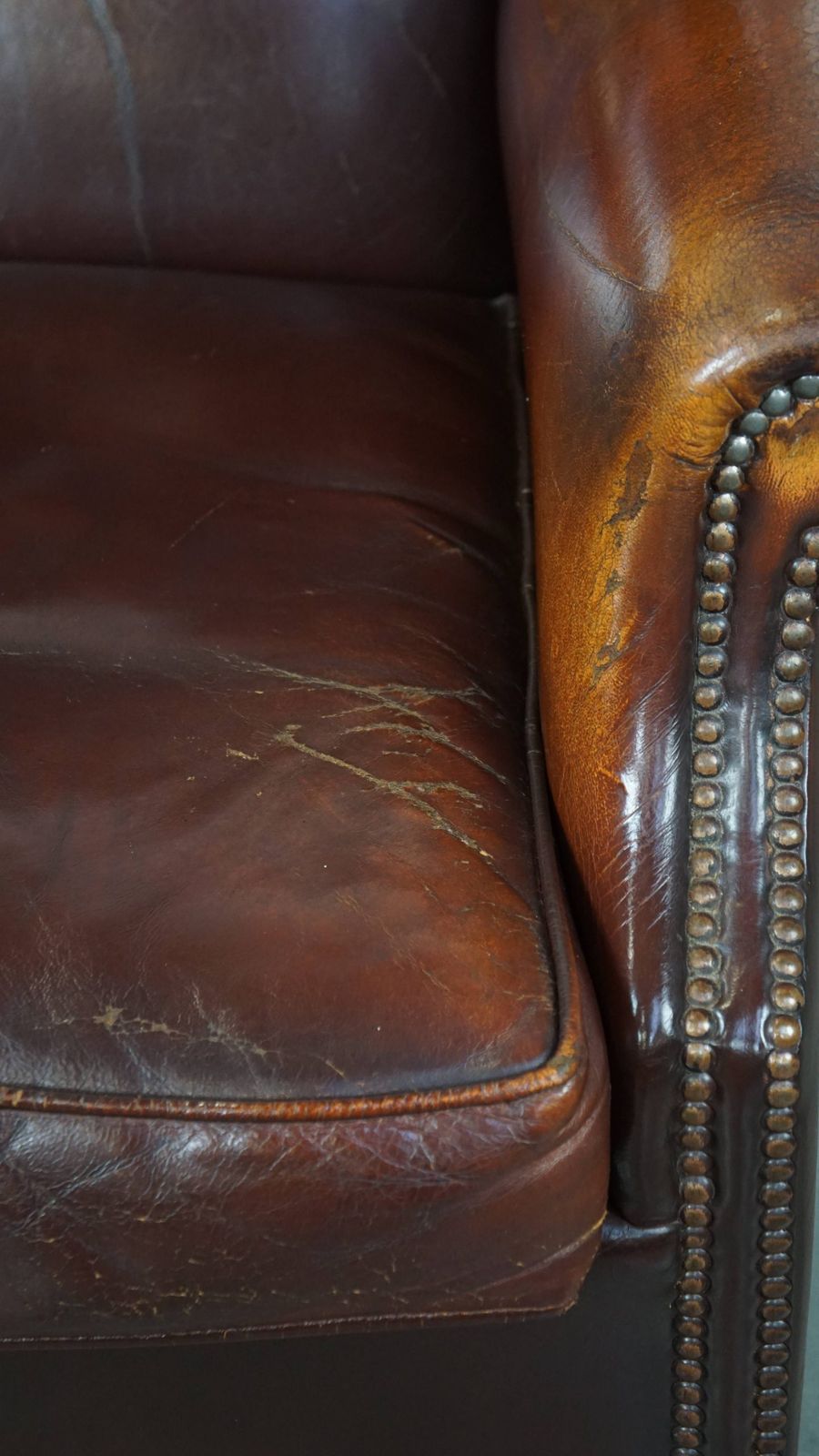 photo furniture Classic, Luxurious And Comfortable Dark English Style Sheepskin Wing Chair With Lots Of Character And A Beautiful Patina