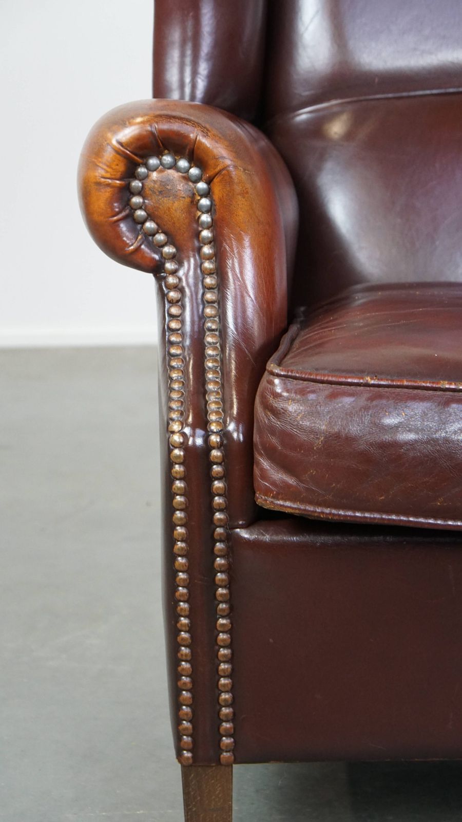 photo for sale Classic, Luxurious And Comfortable Dark English Style Sheepskin Wing Chair With Lots Of Character And A Beautiful Patina