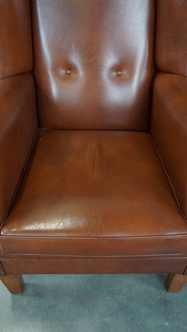 Large Cognac Colored Cowhide English Style Wing Chair In Good Condition photo vinterior