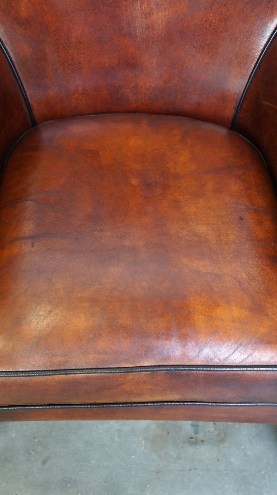 Comfortable Sheepskin Armchair With A Beautiful Finish And Deep Color photo vinterior