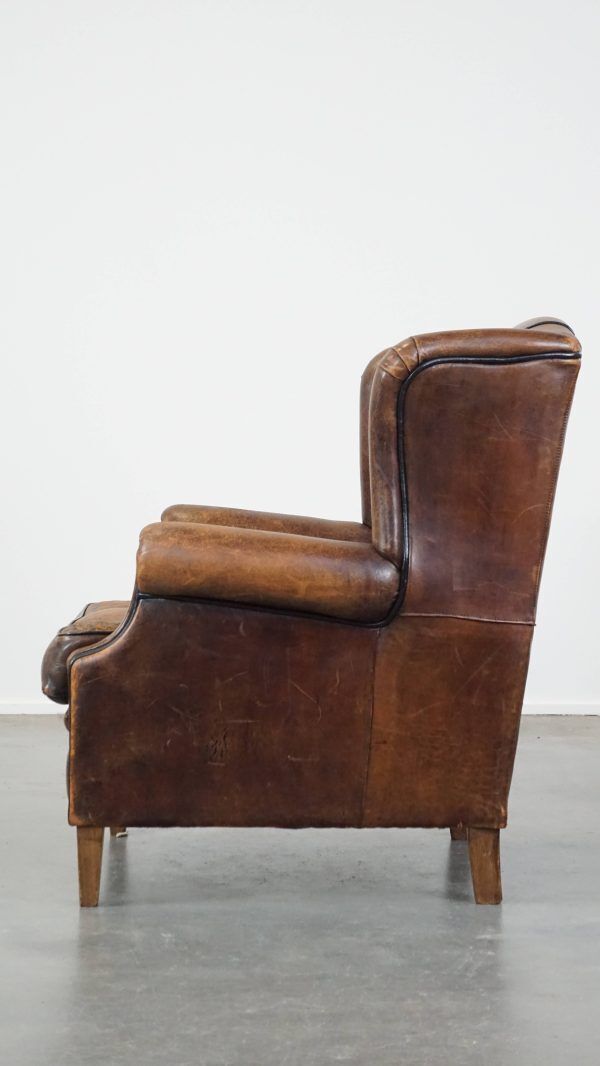 Characteristic And Comfortable Sheepskin Wing Chair With A Beautiful Patina photo 799.4753999999999