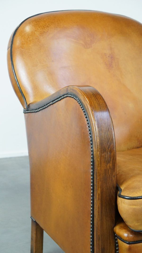 photo furniture Unique, Luxurious Sheepskin Armchair Combined With Wood And Finished With Decorative Nails